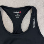 نیم تنه استوک ورزشی برند REEBOK سایز XS